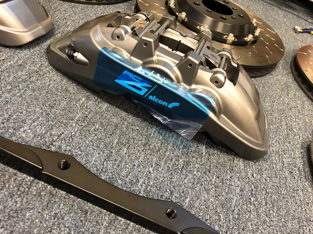 Alcon's RC6 and RC4 calipers with 400mm (15.75") front and 380mm (15.0") rear rotors.